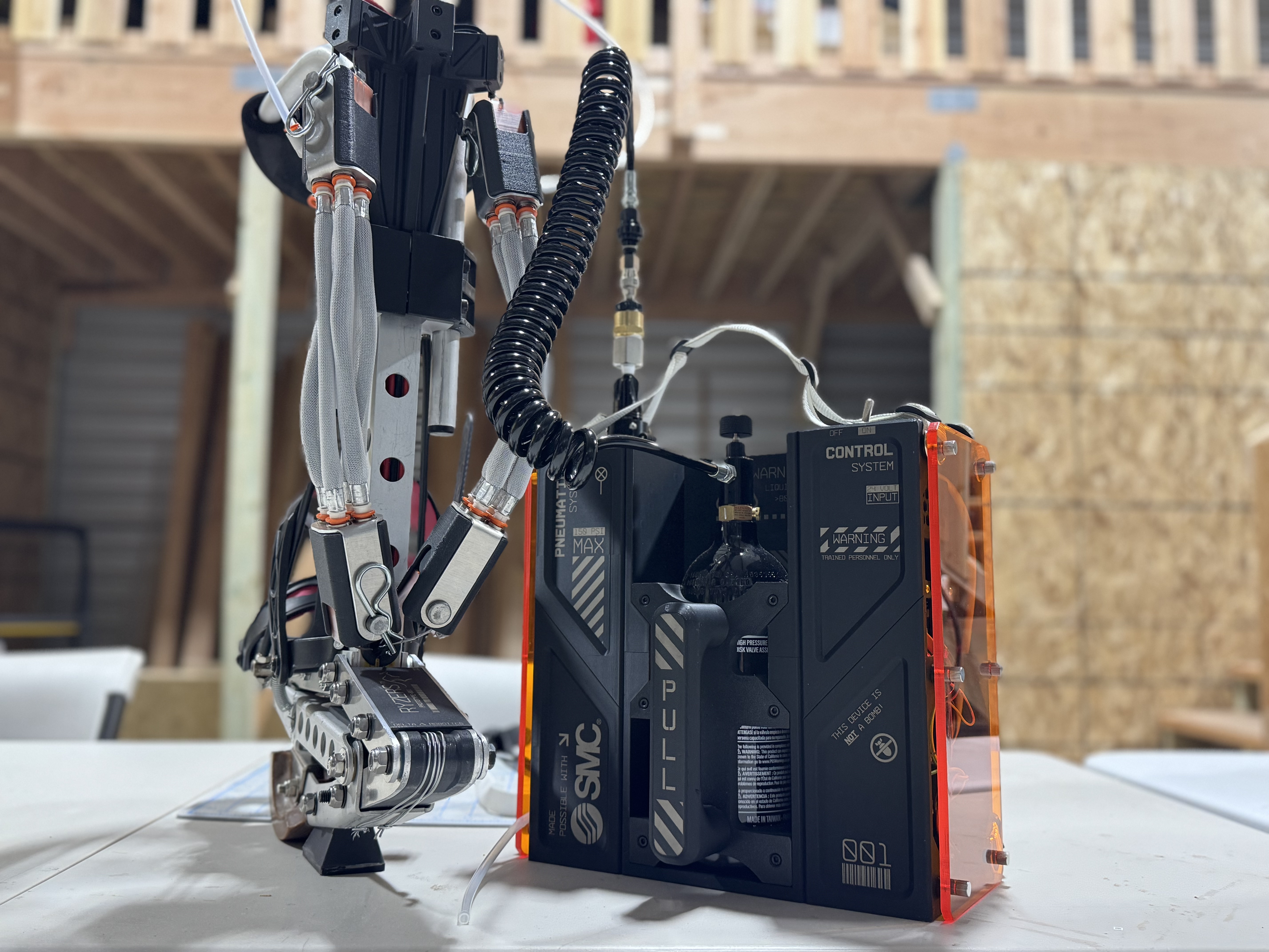 A lower-body exoskeleton frame driven by braided pneumatic muscles